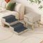 Light gray foldable dog stairs beside a sofa