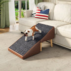 Brown pet ramp beside a sofa with a small dog