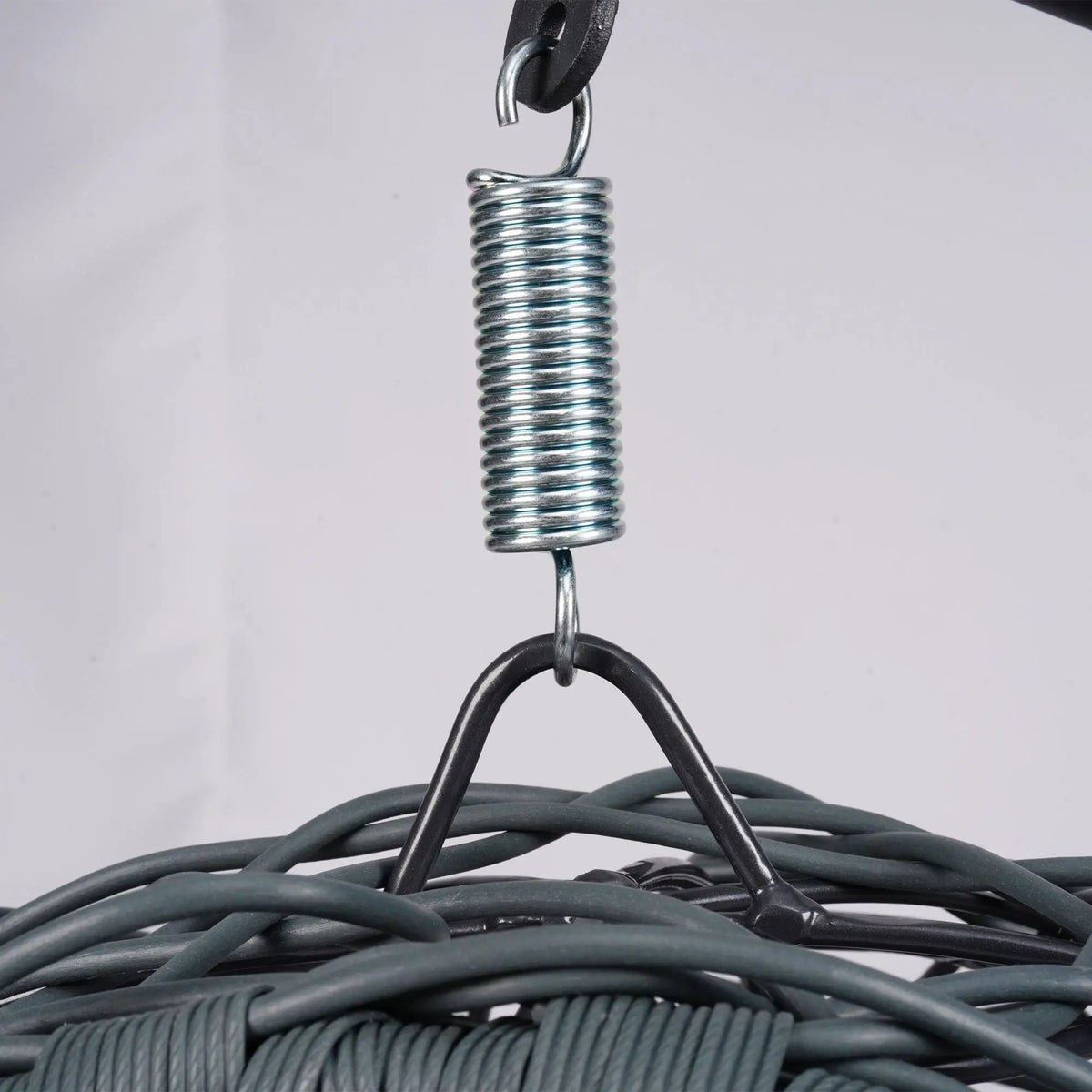Gray rattan-style hanging cat swing bed with cushion and stand — assembly detail