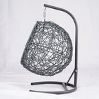 Gray rattan-style hanging cat swing bed with cushion and stand — storage view