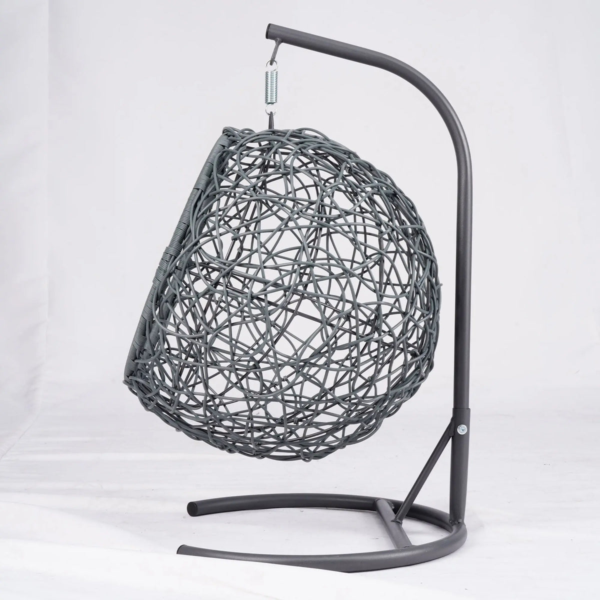Gray rattan-style hanging cat swing bed with cushion and stand — storage view