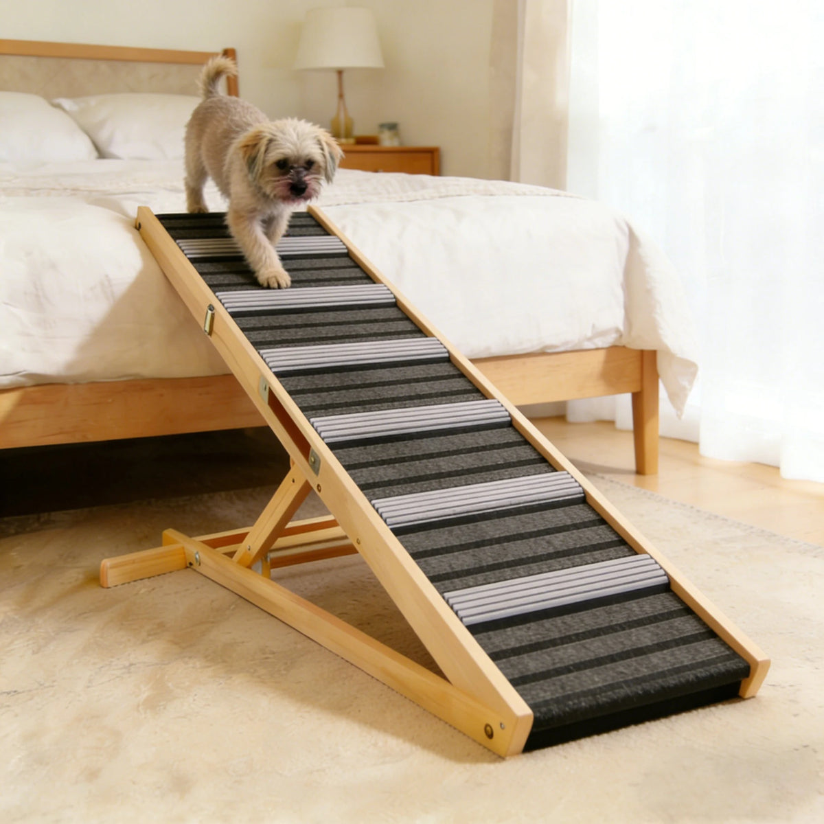 Small dog using a wooden ramp beside a bed