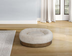 Round beige pet bed with wood trim