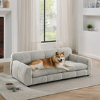 Beige elevated dog sofa bed for large dogs in a bright living room