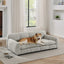 Beige elevated dog sofa bed for large dogs in a bright living room