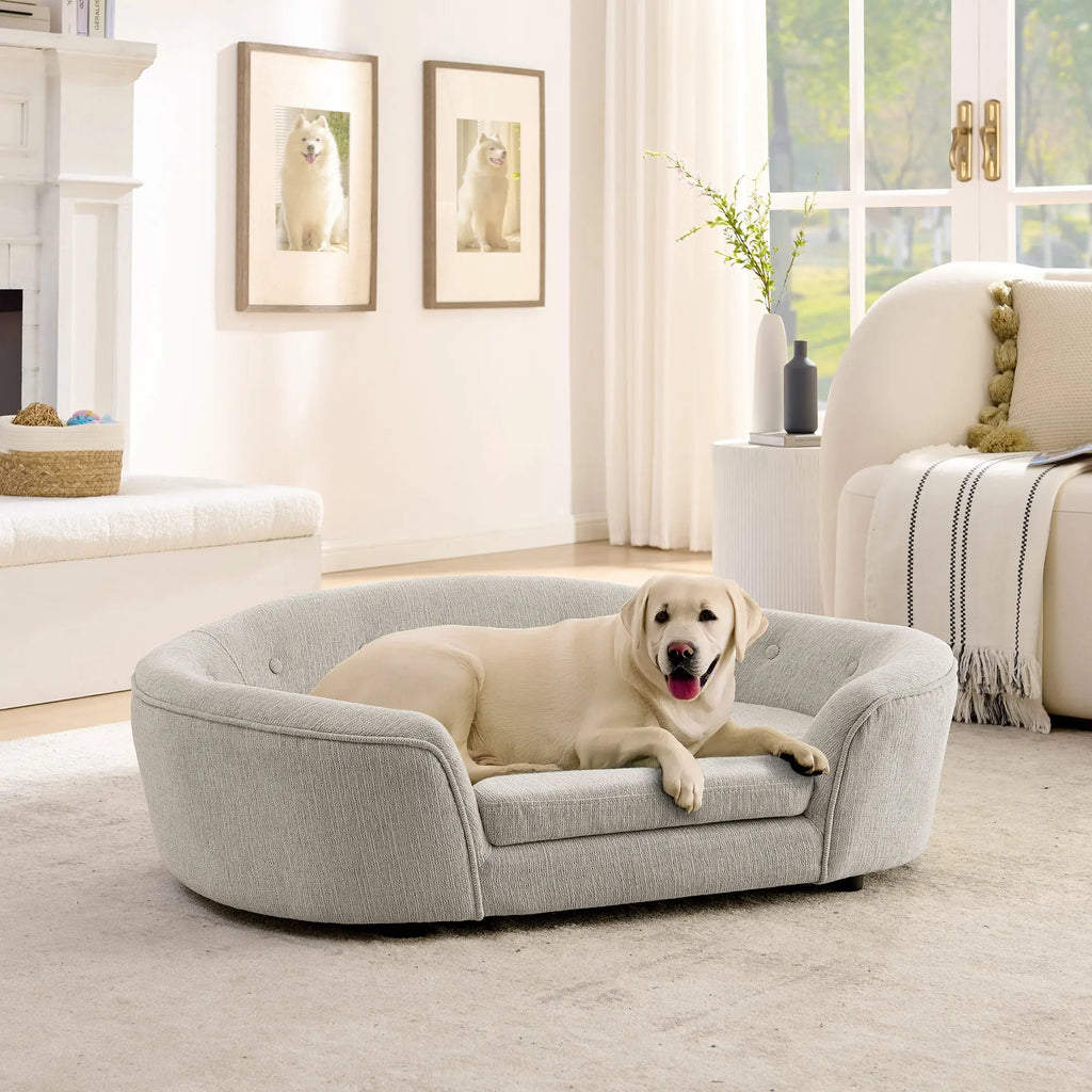 Beige oval dog sofa bed with a large dog in a bedroom