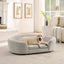 Beige oval dog sofa bed with a large dog in a bedroom