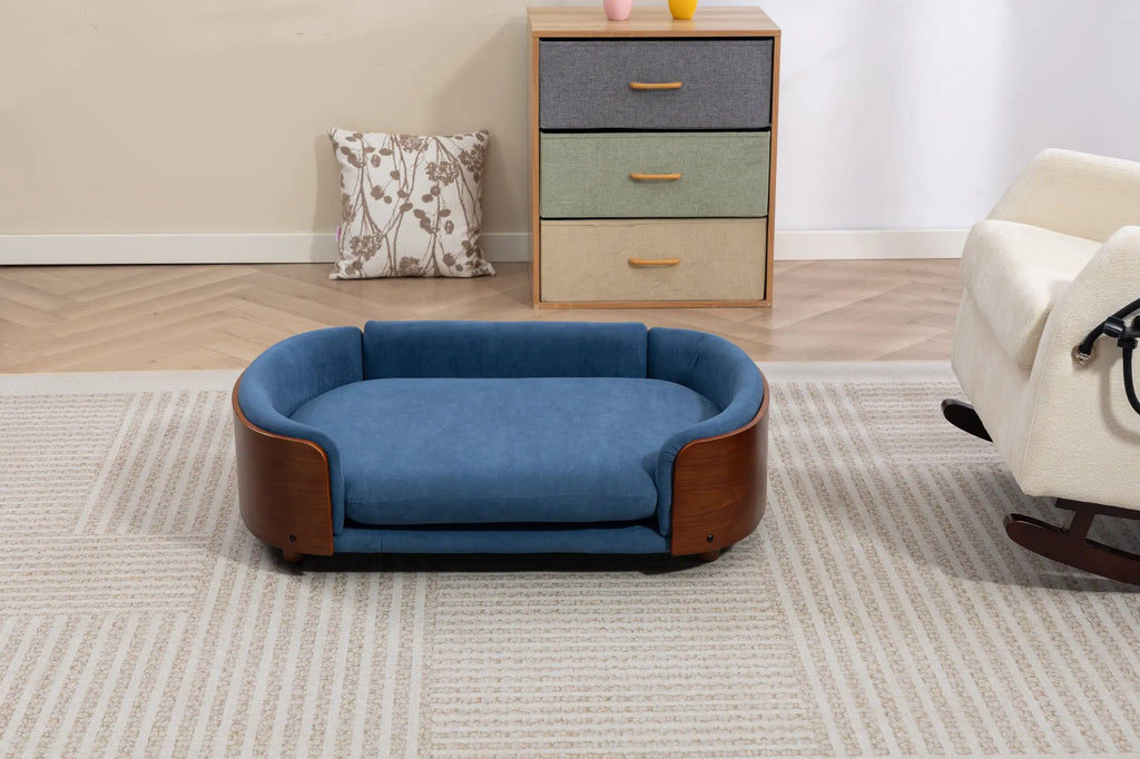 Front view of a blue velvet wooden dog sofa