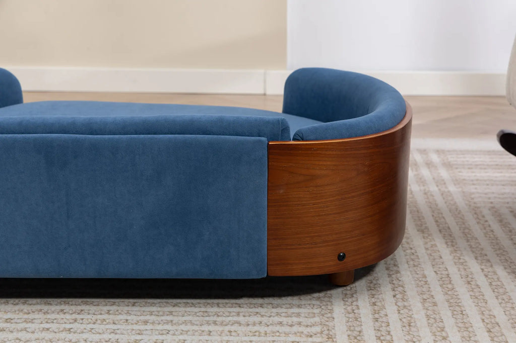 Back exterior of a blue velvet wooden dog sofa