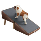 Small dog walking up the brown pet ramp