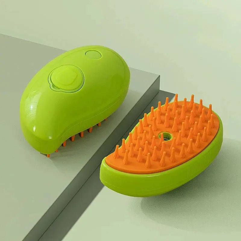 Green mango-shaped cat mist grooming brush with orange bristles