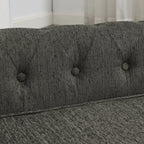 Button-tufted backrest and textured dark gray upholstery