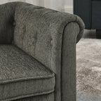 Close-up of the upholstered rolled arm and seat cushion