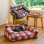 Cat and dog relaxing in patterned pet sofas