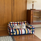 Multicolor pet sofa beside a room partition