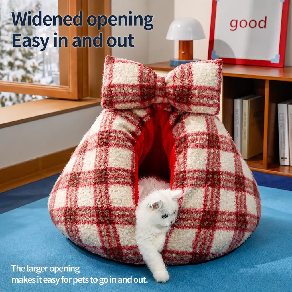 Cat stepping through red plaid bed opening