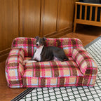 Pink plaid pet sofa with dog