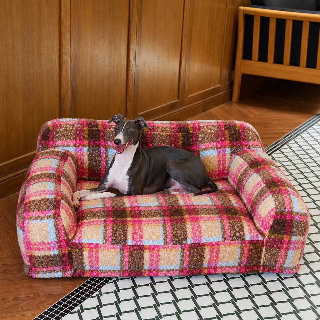 Pink plaid pet sofa with dog