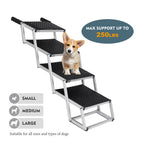 Small dog standing on black foldable dog stairs