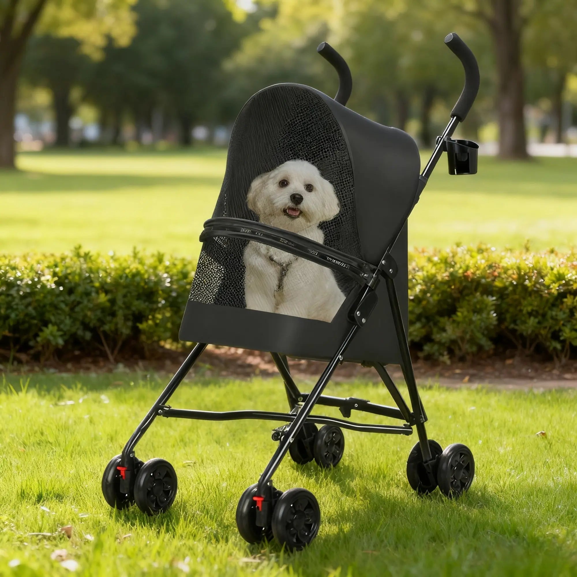 Small white dog in a black foldable pet stroller at a park