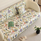 Green floral sectional couch cover shown across sofa cushions