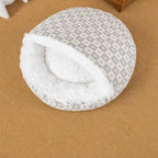 Gray patterned plush shell bed in a home setting