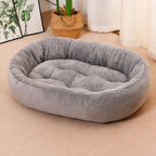Oval Plush Bolster Pet Bed with Non-Slip Base shown in the product photo