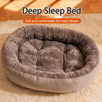 Oval fleece pet bed in warm indoor scene