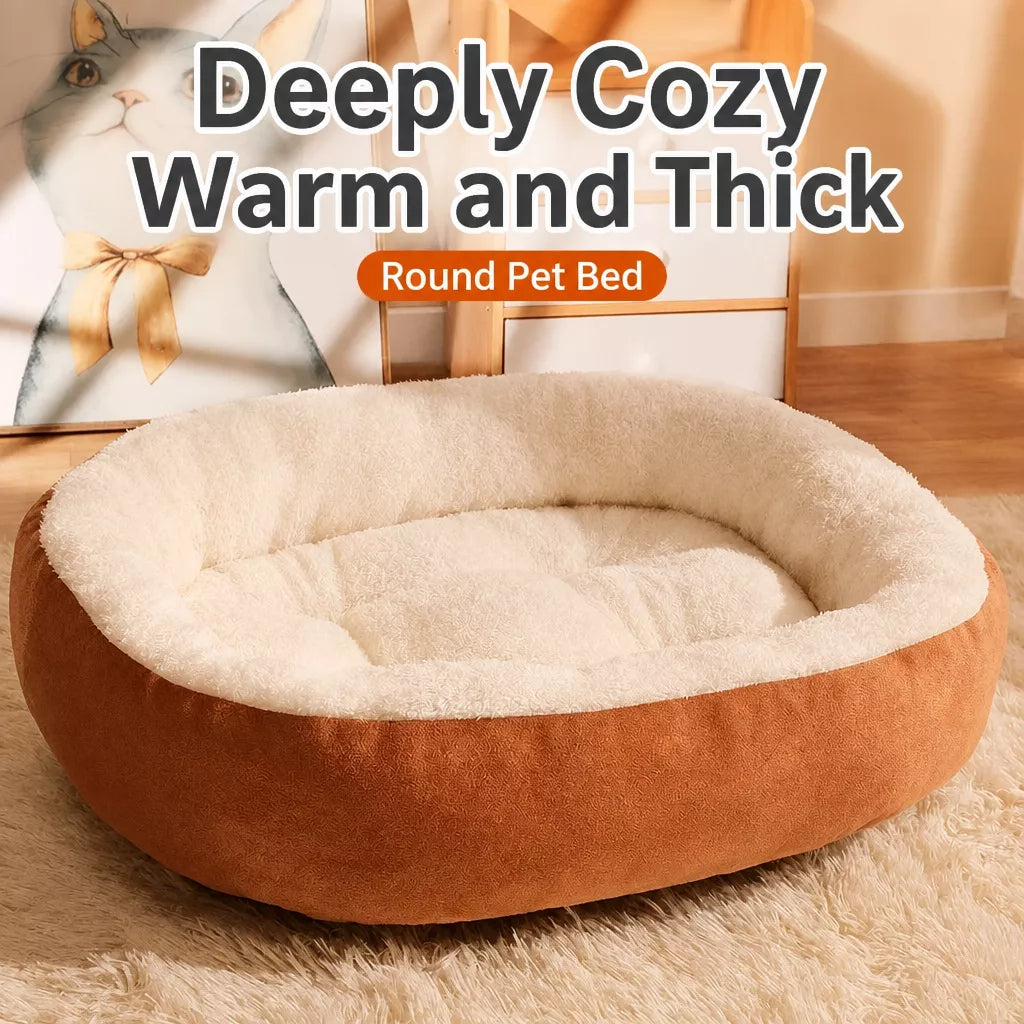 Cream-lined oval pet bed with orange outer fabric