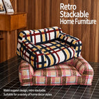 Two patterned pet sofa beds stacked empty