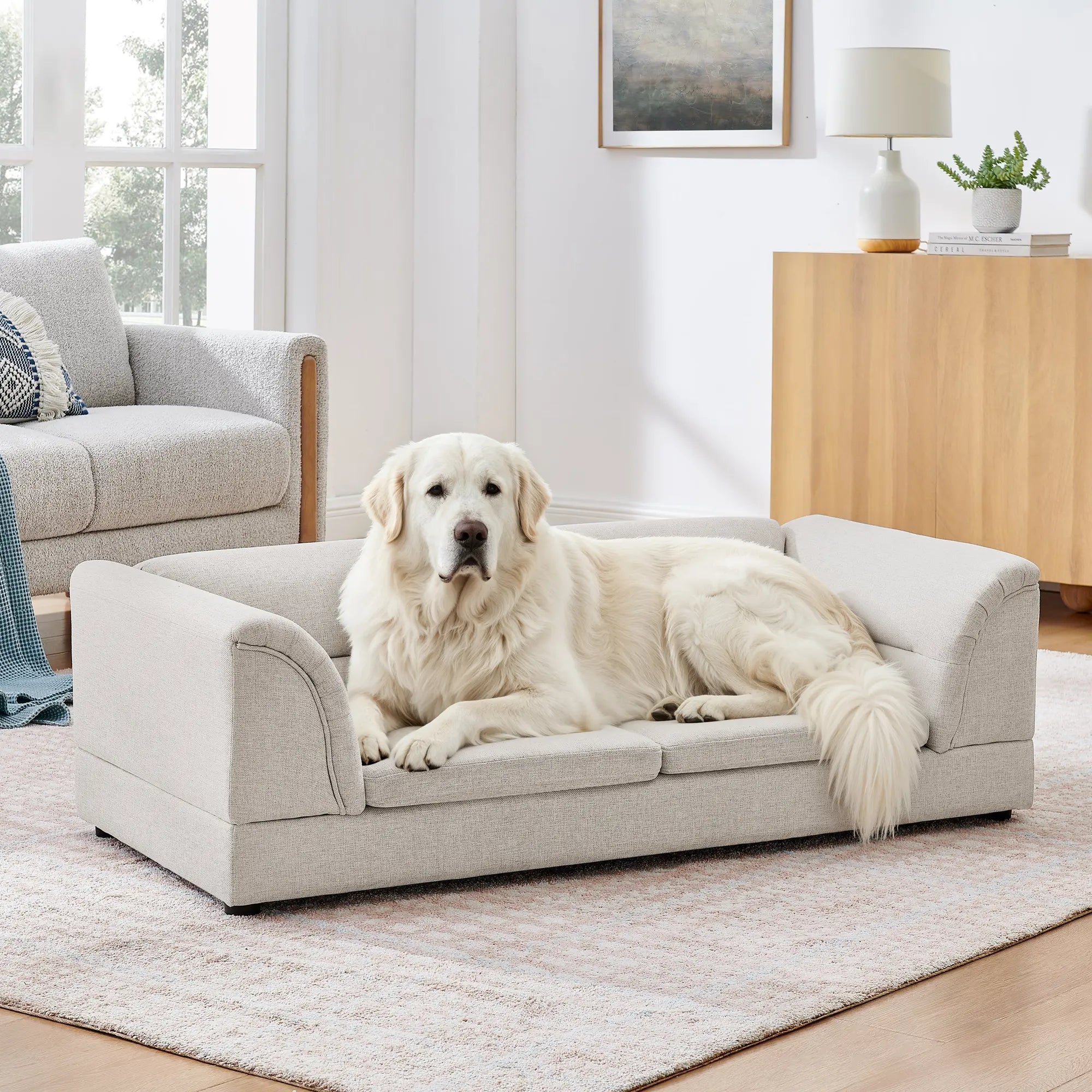 Large dog resting on an oversized beige dog sofa bed Main image