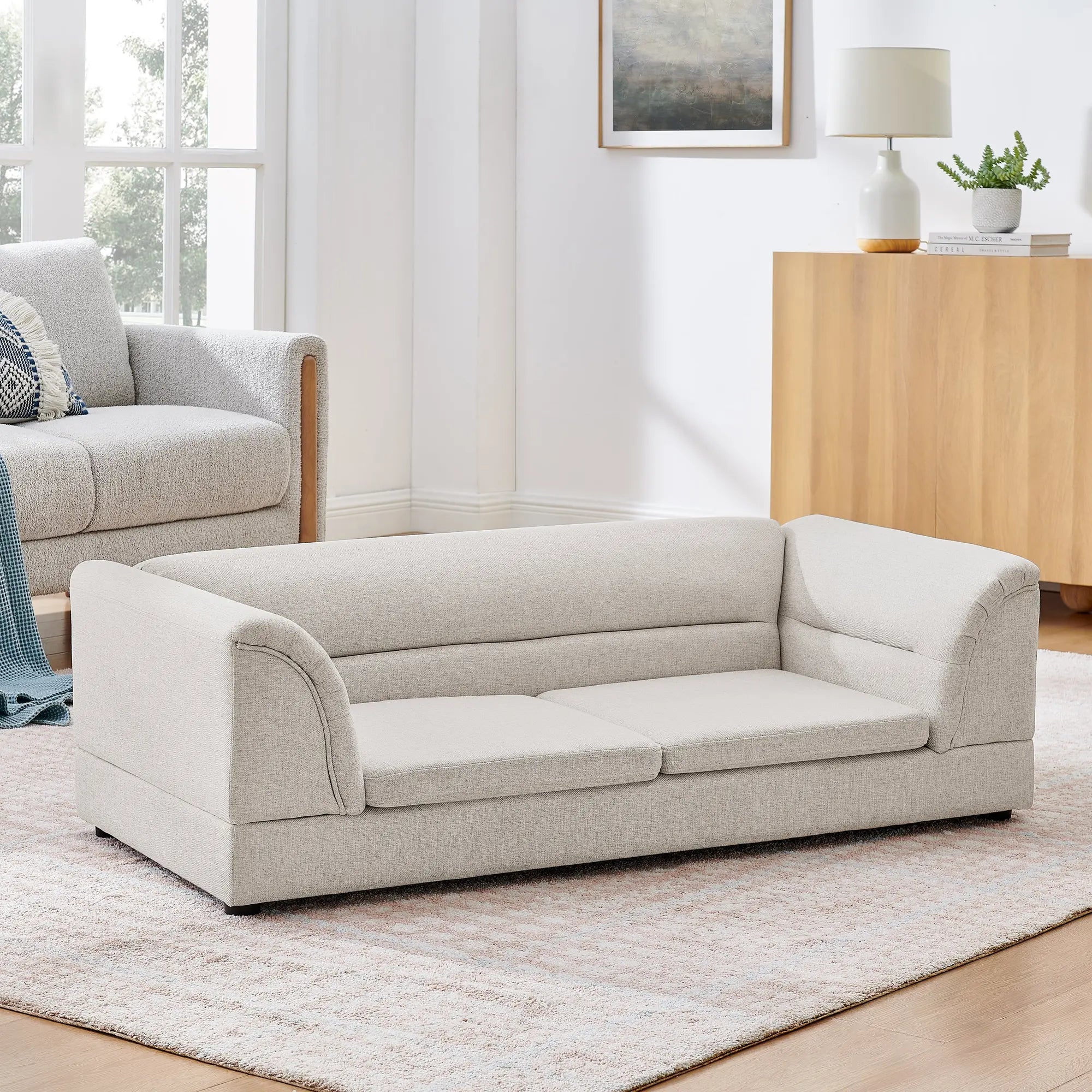 Oversized beige dog sofa bed in a modern living room