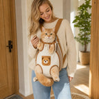 Beige and brown hands-free pet carrier backpack with orange tabby cat