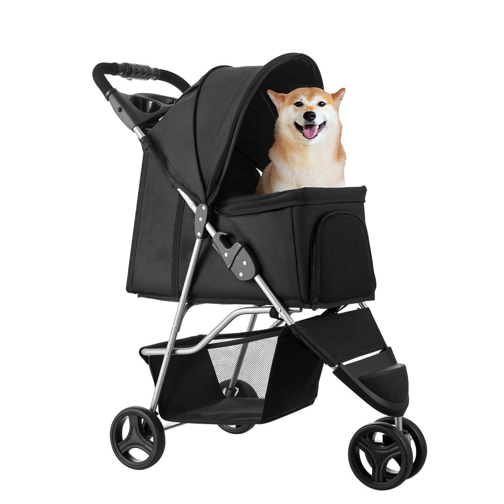 Small dog sitting in black pet stroller