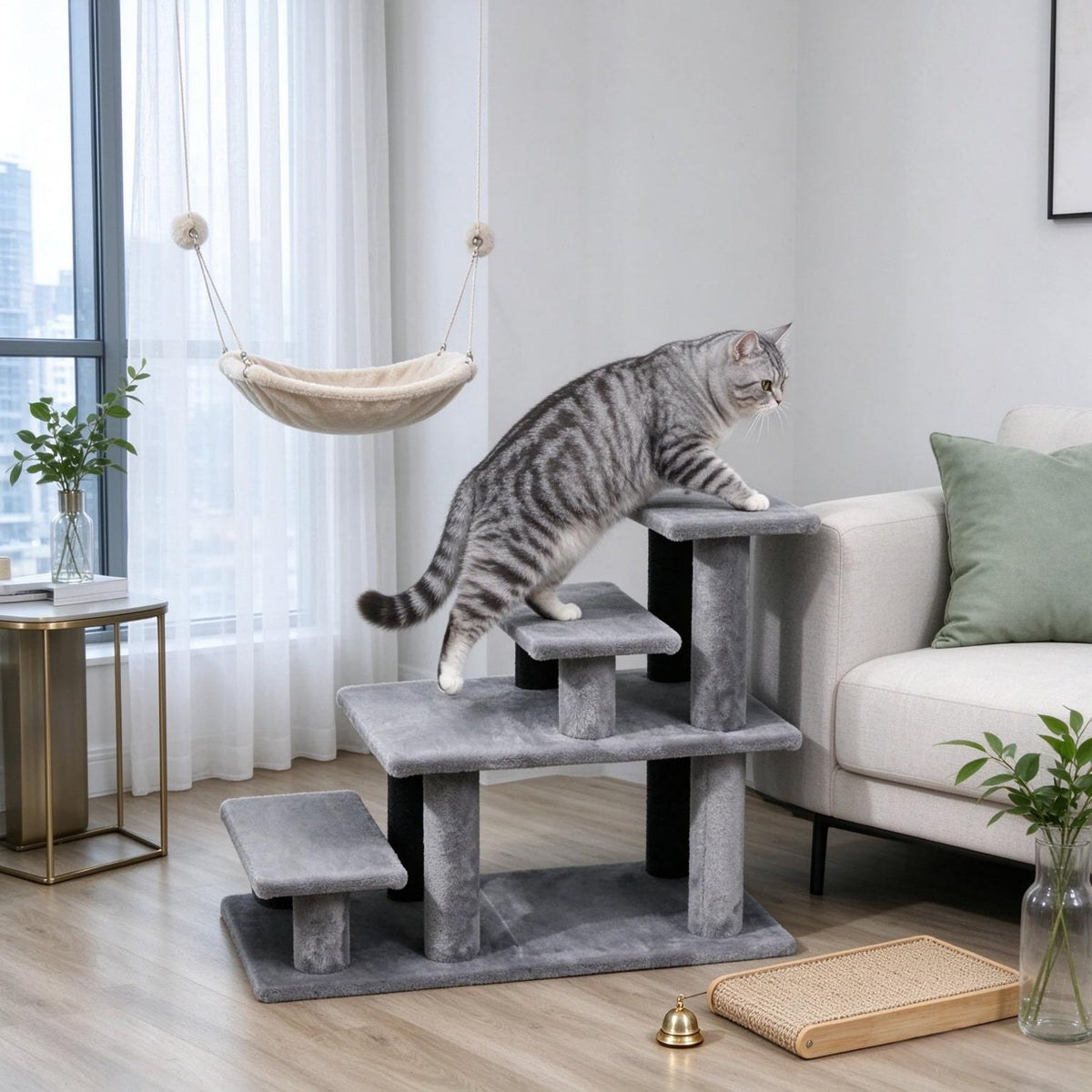 Cat using gray plush pet stairs beside a sofa