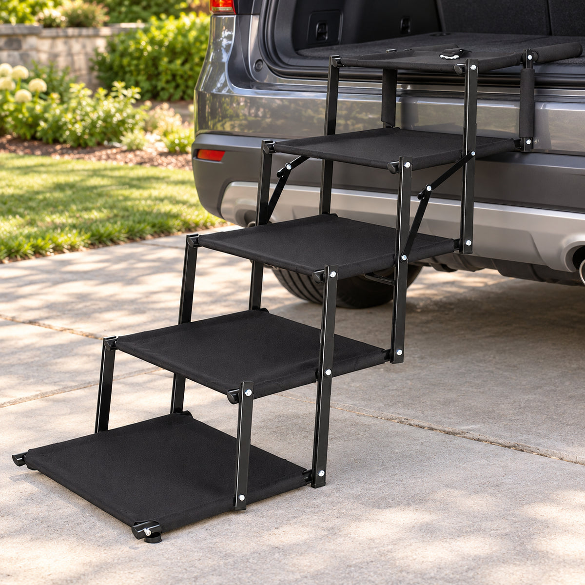 Black folding five-step dog stairs positioned at an SUV on a driveway Main image