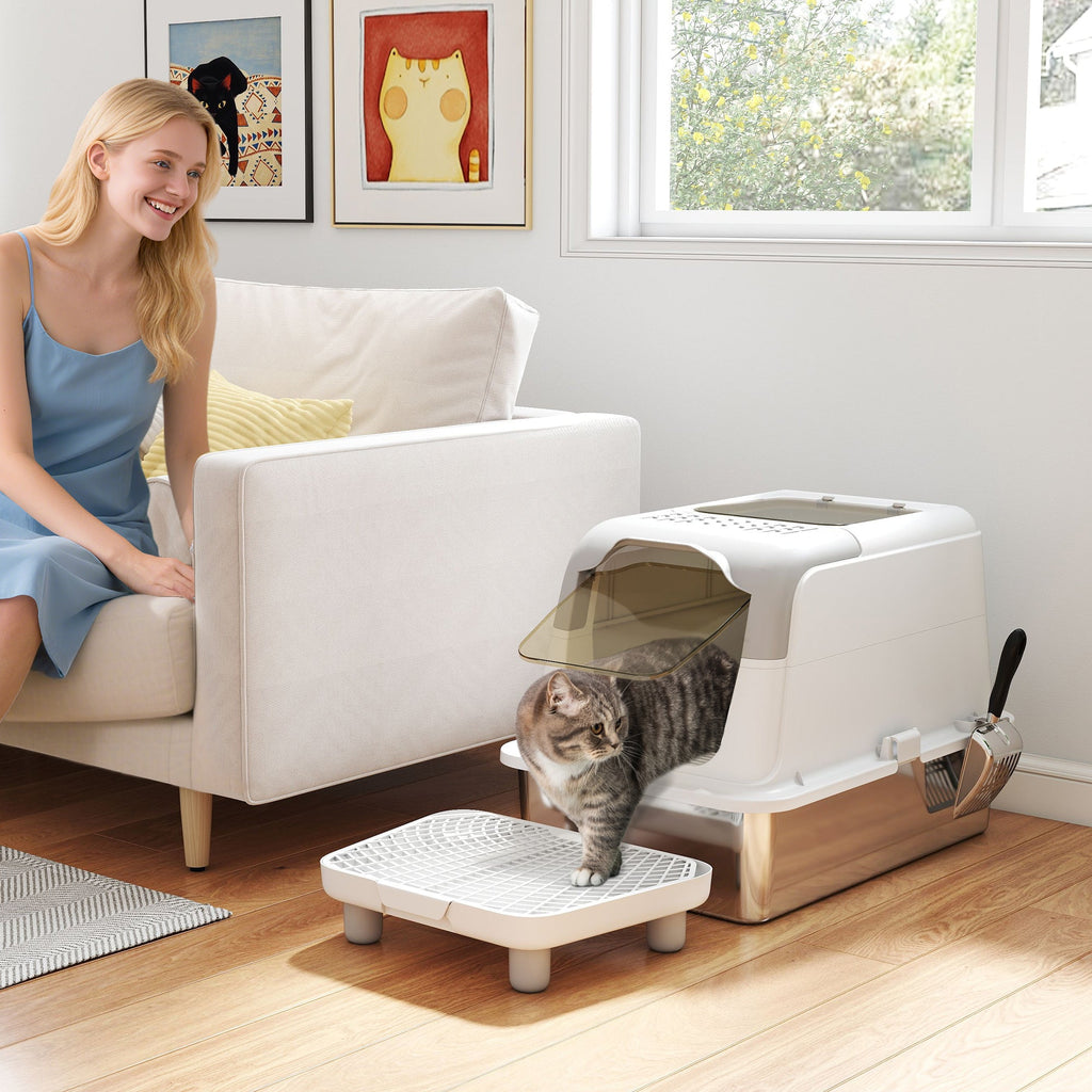 White enclosed stainless steel litter box — home placement