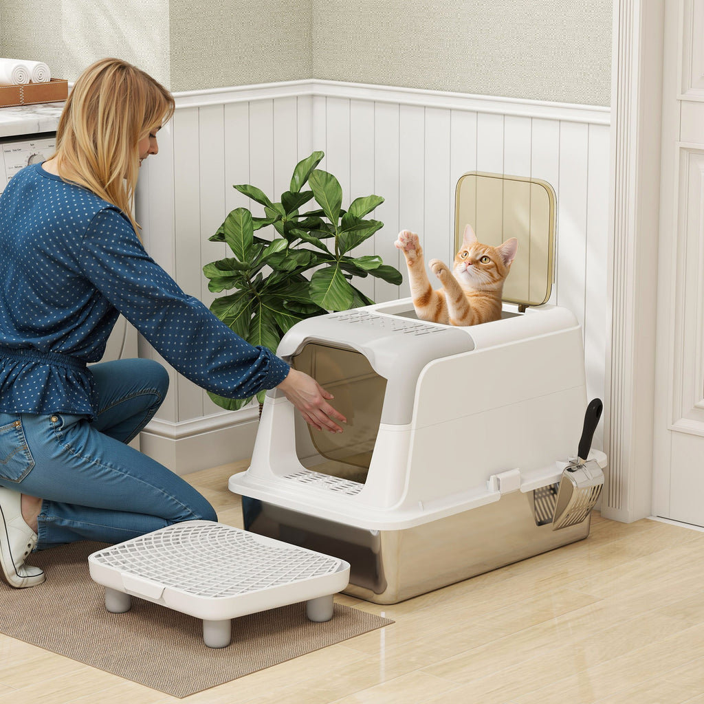 White enclosed stainless steel litter box — angled room view