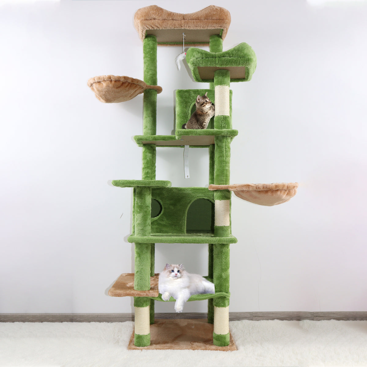 68-Inch Green Cat Tree with Hammocks — full tower beside a window