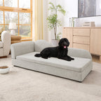 Beige upholstered dog sofa — small dog on sofa