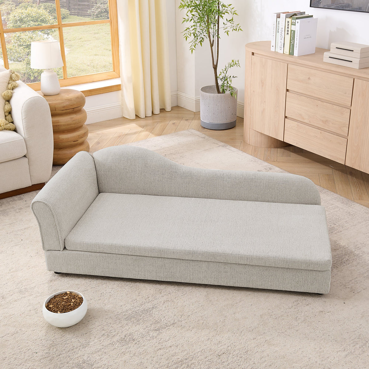 Beige upholstered dog sofa — angled room view