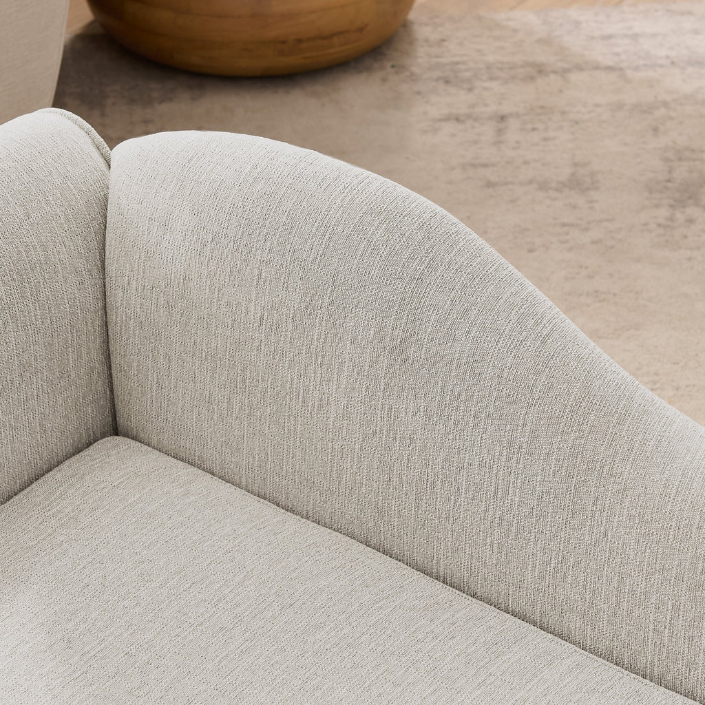 Beige upholstered dog sofa — curved backrest