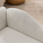 Beige upholstered dog sofa — curved backrest