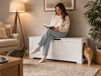 White hidden cat litter box cabinet used as a living room bench