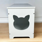 Cat-shaped side entrance on hidden litter box cabinet